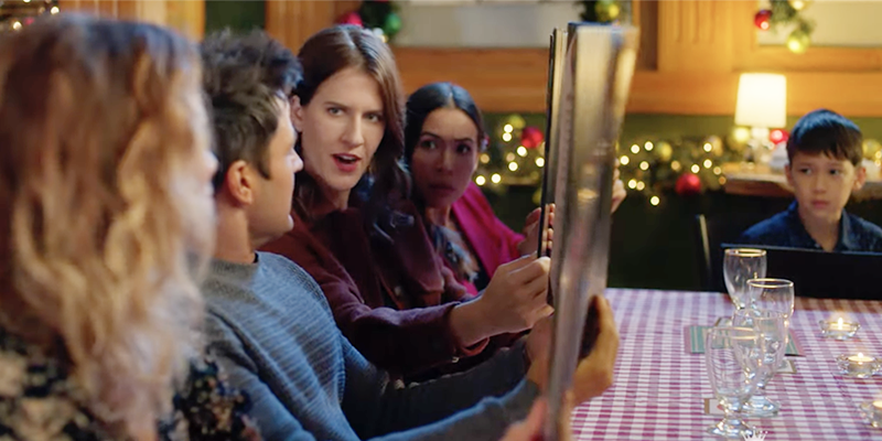 Part of the most-read posts collage. List of the posts is below. This is a screen cap from Hallmark's An Unexpected Christmas. Someone who is presumably a lesbian is sitting at a dinner table, looking at a man with a scandalized face from behind a menu.