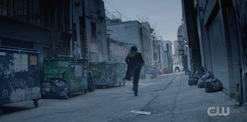 Sophie running down an alley