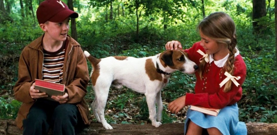 two kids with their dog, skip