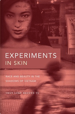 Cover of Experiments in Skin shows a figure rushing by an advertisement centering an Asian model