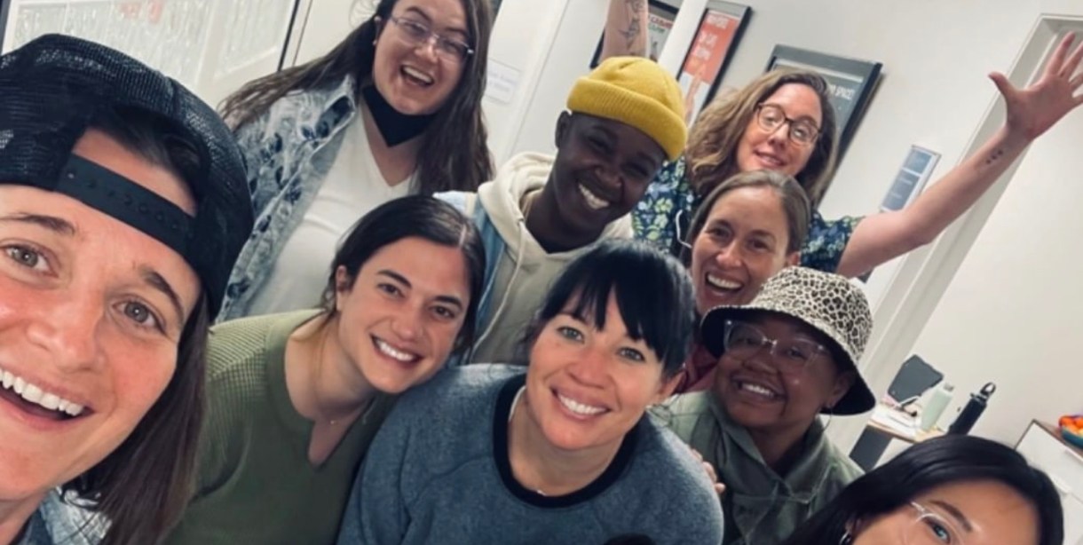 group of L Word Season 3 writers room writers posing for a selfie