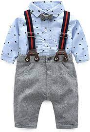 this is a baby outfit with a blue collared shirt with a polka dot pattern striped suspenders and gray tweed pants with a matching gray bow tie