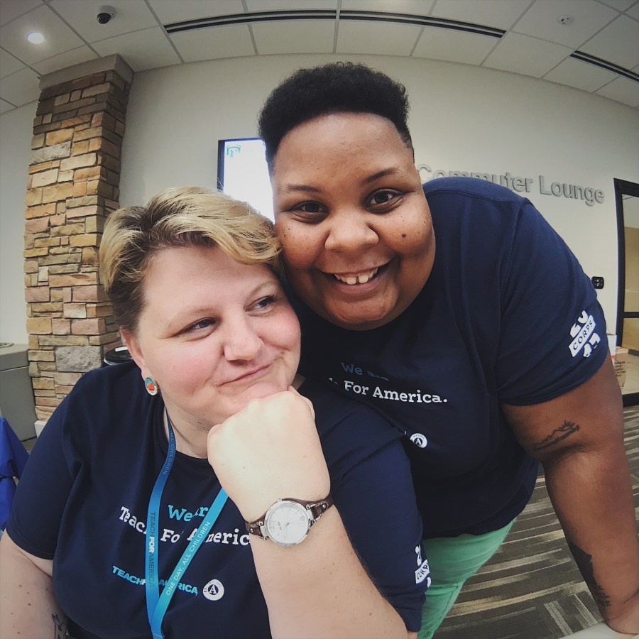 shea and Jane in Teach for America tee shirts pose together and smile.