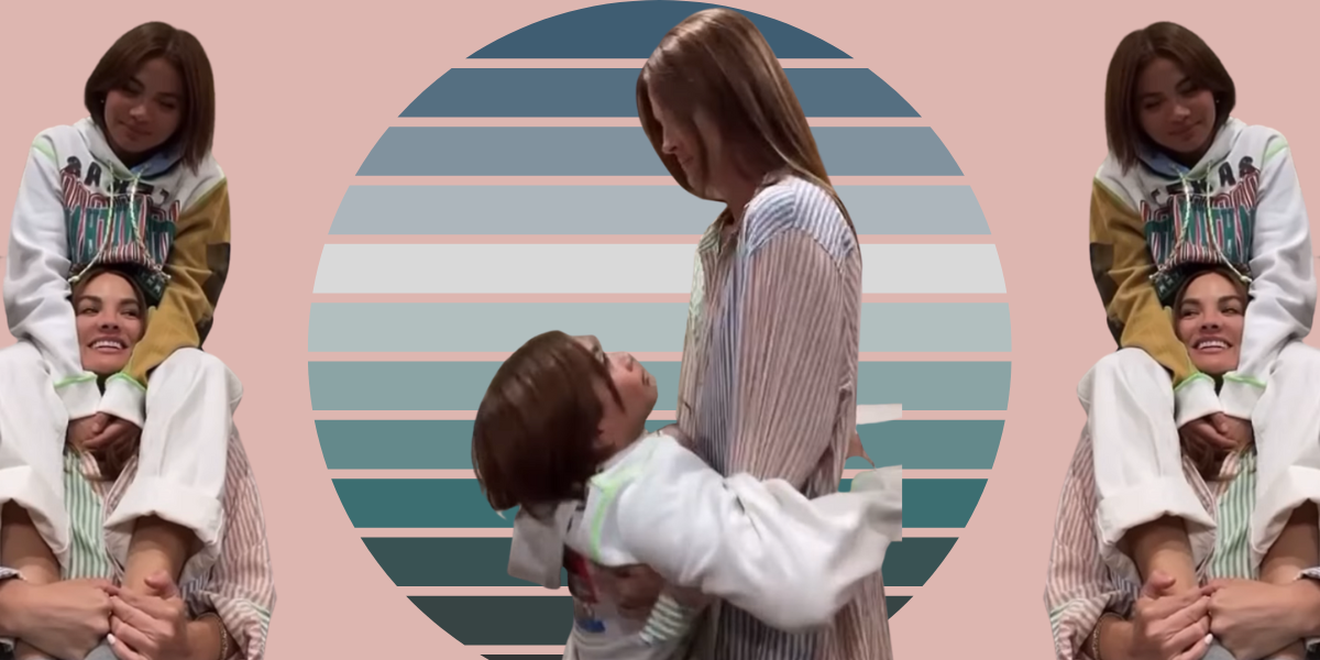 Hayley Kiyoko and Becca Tilley are holding onto each other in the center photo with a blue circle behind them. On either side of the central photo are the same image of Hayley sitting on Becca's shoulders.