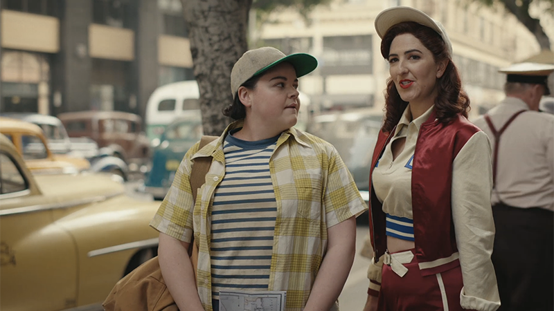 Greta and Jo talk to each other on the sidewalk in Chicago 