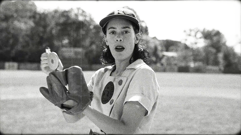 Lupe puts on lipstick on the pitcher's mound