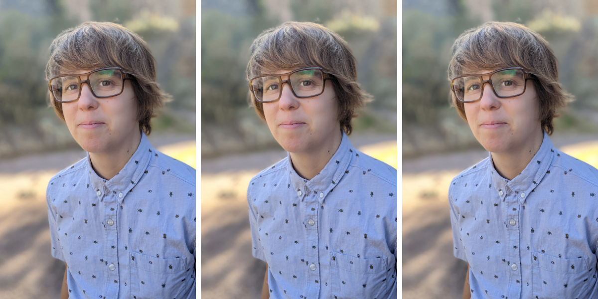 Lydia Conklin wears large rectangular framed glasses and has a swoopy short haircut and wears a shortsleeved blue buttonup.