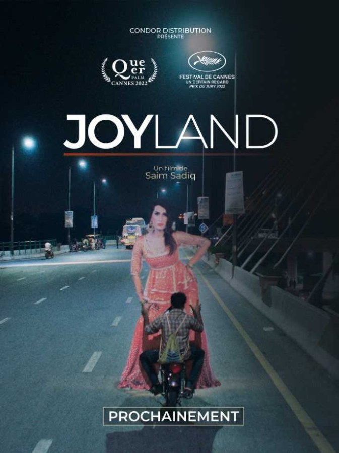 movie cover of joyland shows a man on a motorbike riding down the street somehow carrying a pakistani woman in a pink outfit