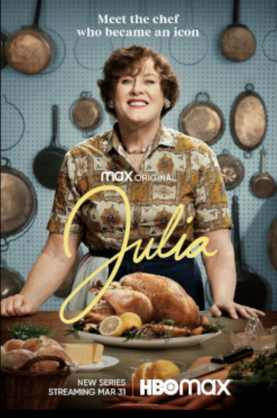 the cover of julia shows the actress portraying julia child in a kitchen with a chicken on a table in front of her