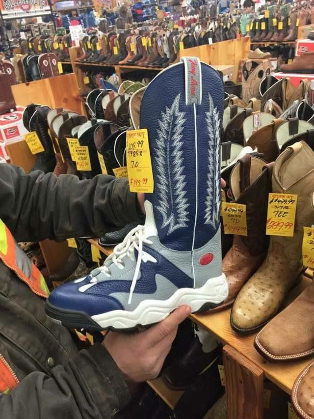 a pair of boots, made out of blue and white sneaker material, with the upper part looking like a normal ish cowboy boot and the bottom part very much looking like a running shoe