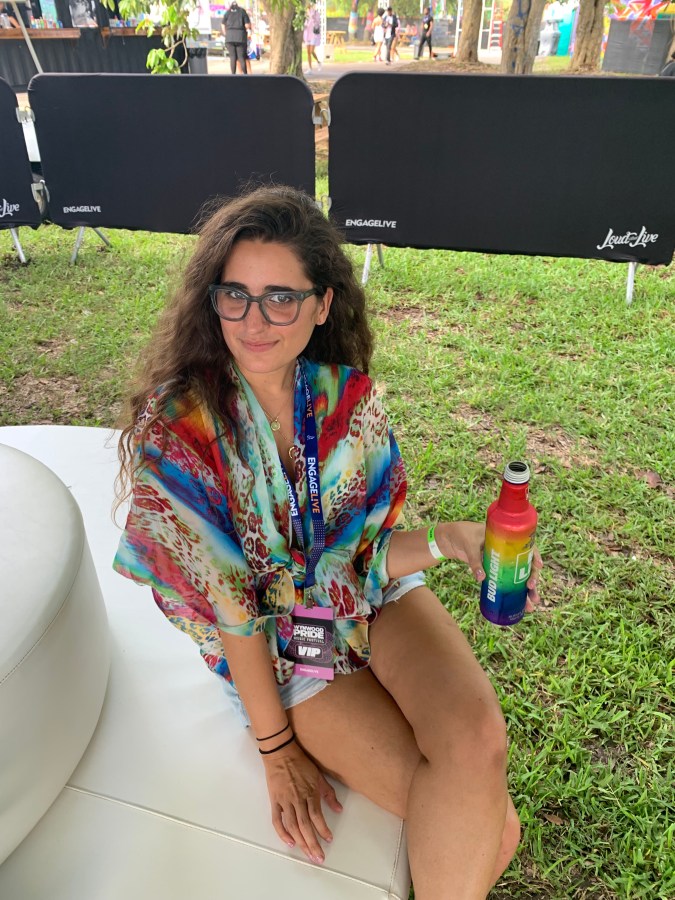 Kayla Kumari Upadhyaya holds a Bud Light at Pride