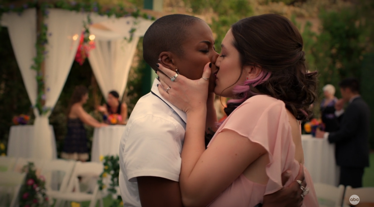 Sarah and Denise make out at a weeding