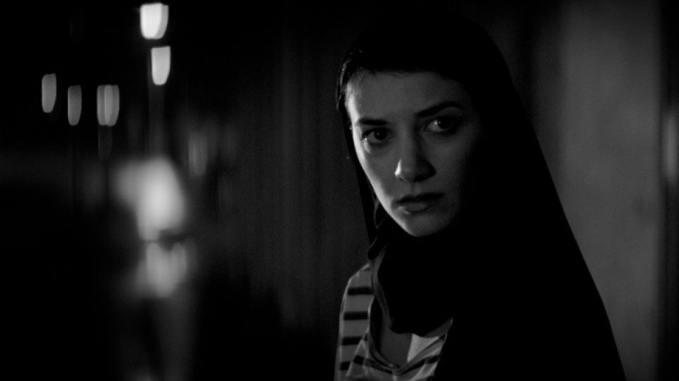 The Girl in A Girl Walks Home Alone At Night in black and white
