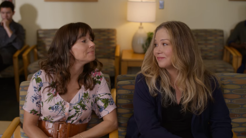 Judy and Jen sit in a doctor's office waiting room