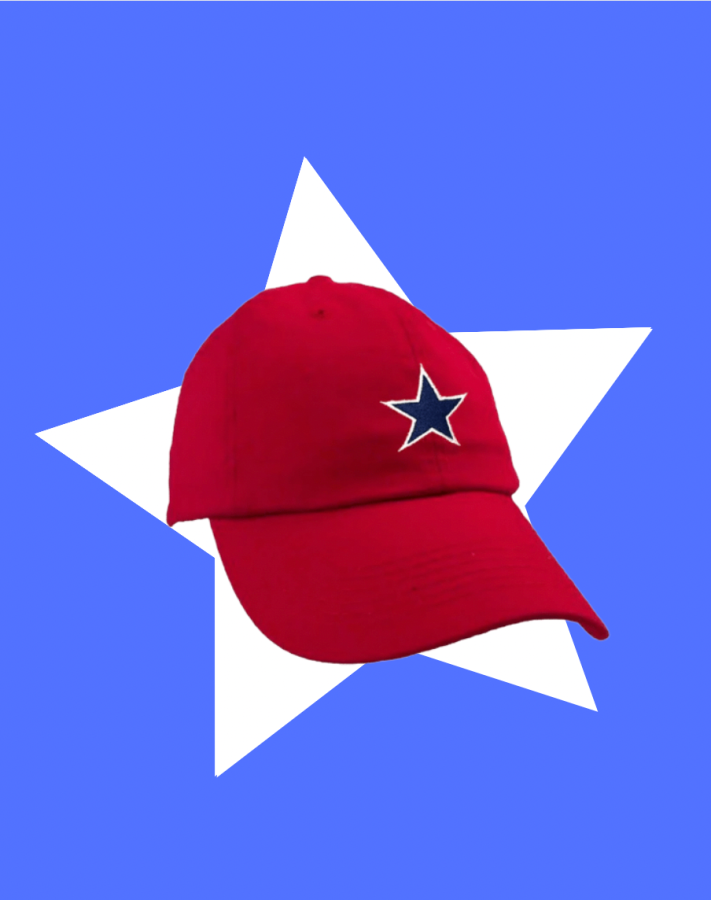 The All Stars Cap on a blue background. The Cap is retro red with an embroidered navy star. The star is outlined with white stitching. It's super cute and simple! This cap represents Max Chapman's baseball team, Red Wright's All Stars, one of the main teams in the 2022 tv show "A League Of Their Own."