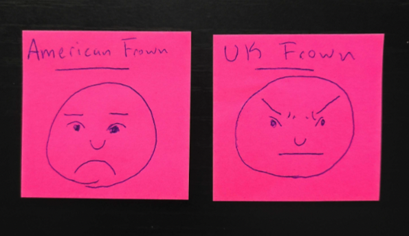two pink post its, one labeled American Frown, the other labeled UK Frown, are side by side. On each, a simple cartoony face. The american frown shows someone frowing with their mouth. The UK frown has a flat straight line mouth but someone frowning with their brows.