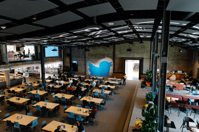 a recent photo of twitter HQ showing a good number of empty desks