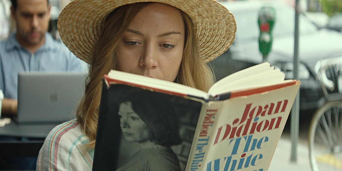 Aubrey Plaza reading a Joan Didion book