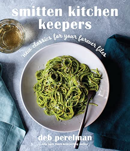 the cover of smitten kitchen keepers showing a bowl of pesto pasta