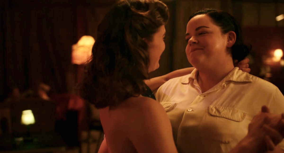 Jo dances with the woman who's been flirting with her all night at the gay bar