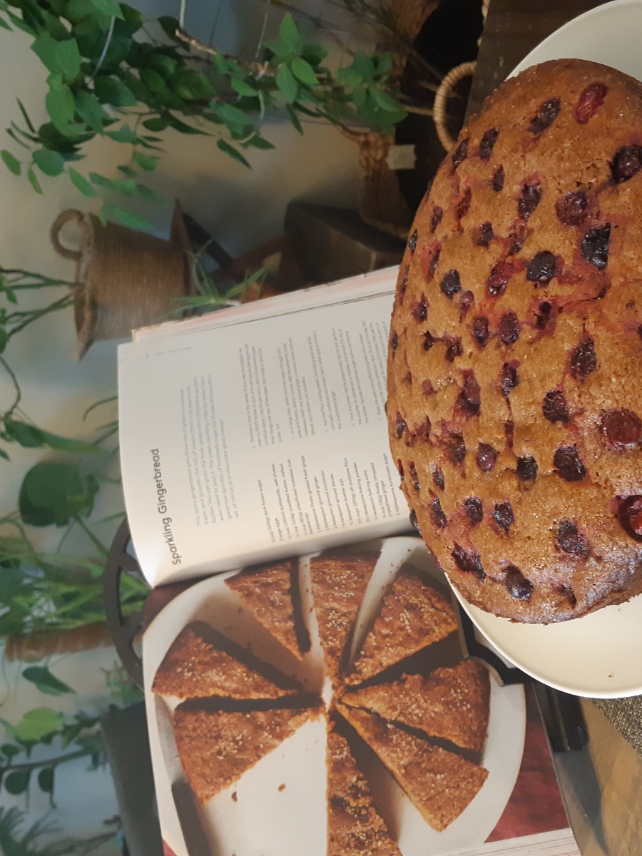 A gingerbread cake on a cake stand