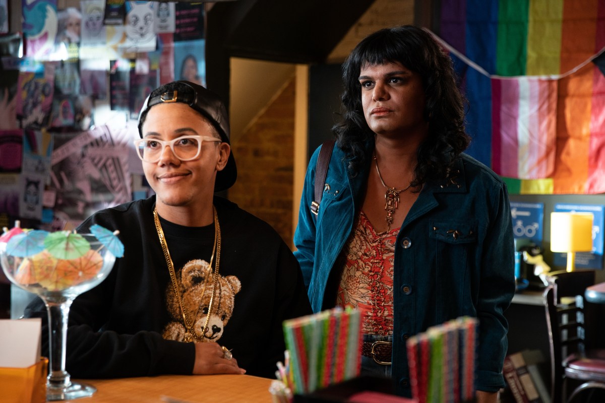 7even and Sabi standing in a gay bar