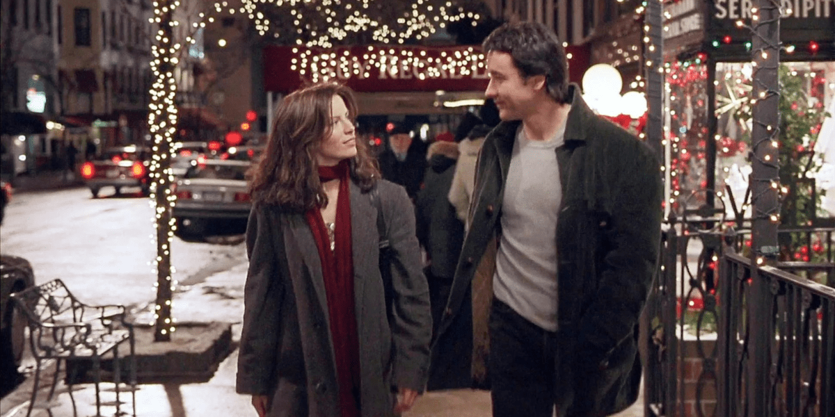 Kate Beckinsale and John Cusack walk together outside in the movie Serendipity