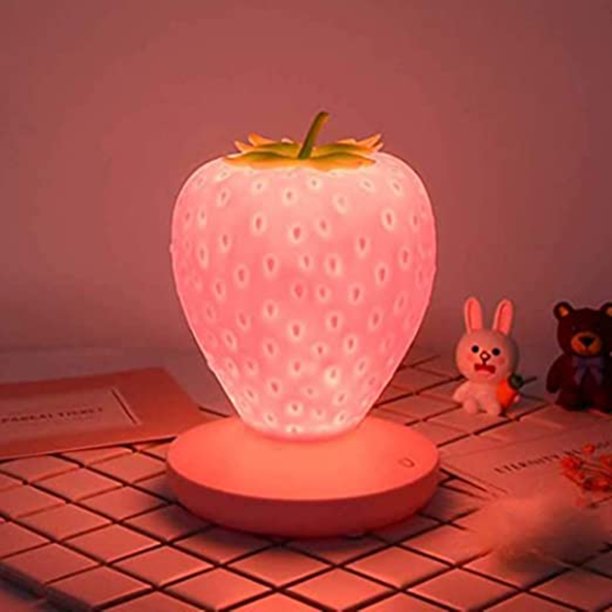 A light up pink strawberry lamp