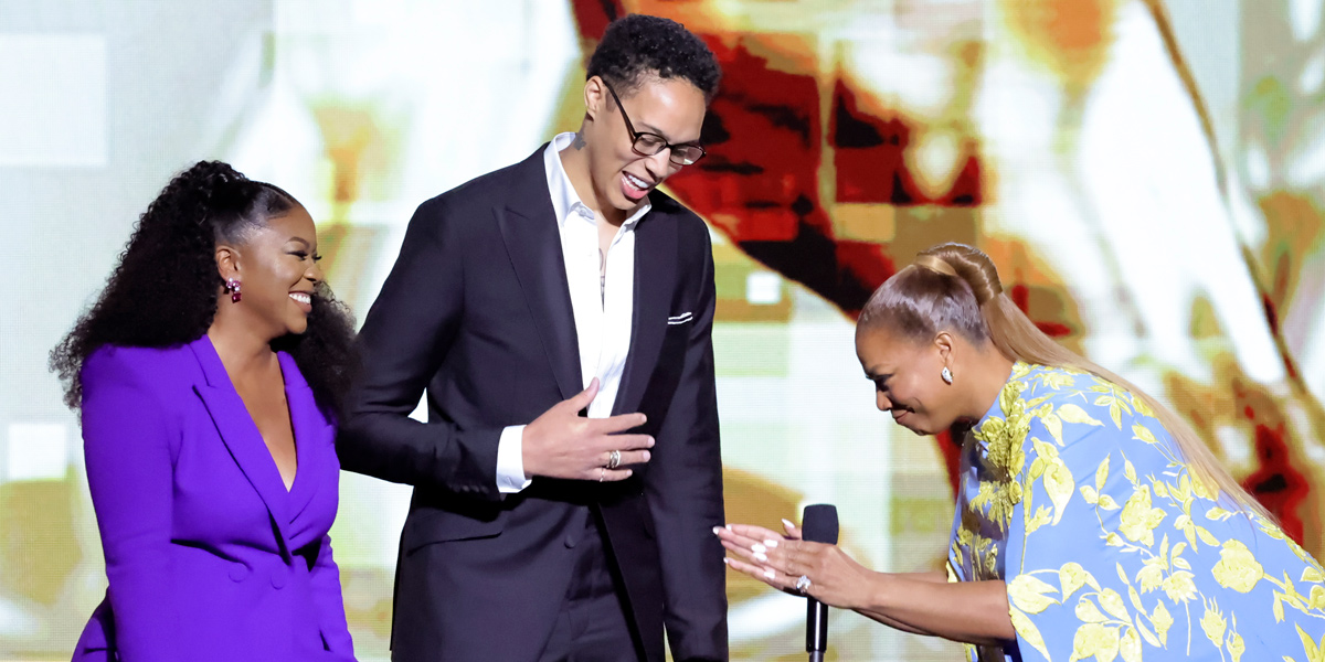 Queen Latifah bows to Brittney Griner and Cherelle Griner on stage at the NAACP Image Awards.
