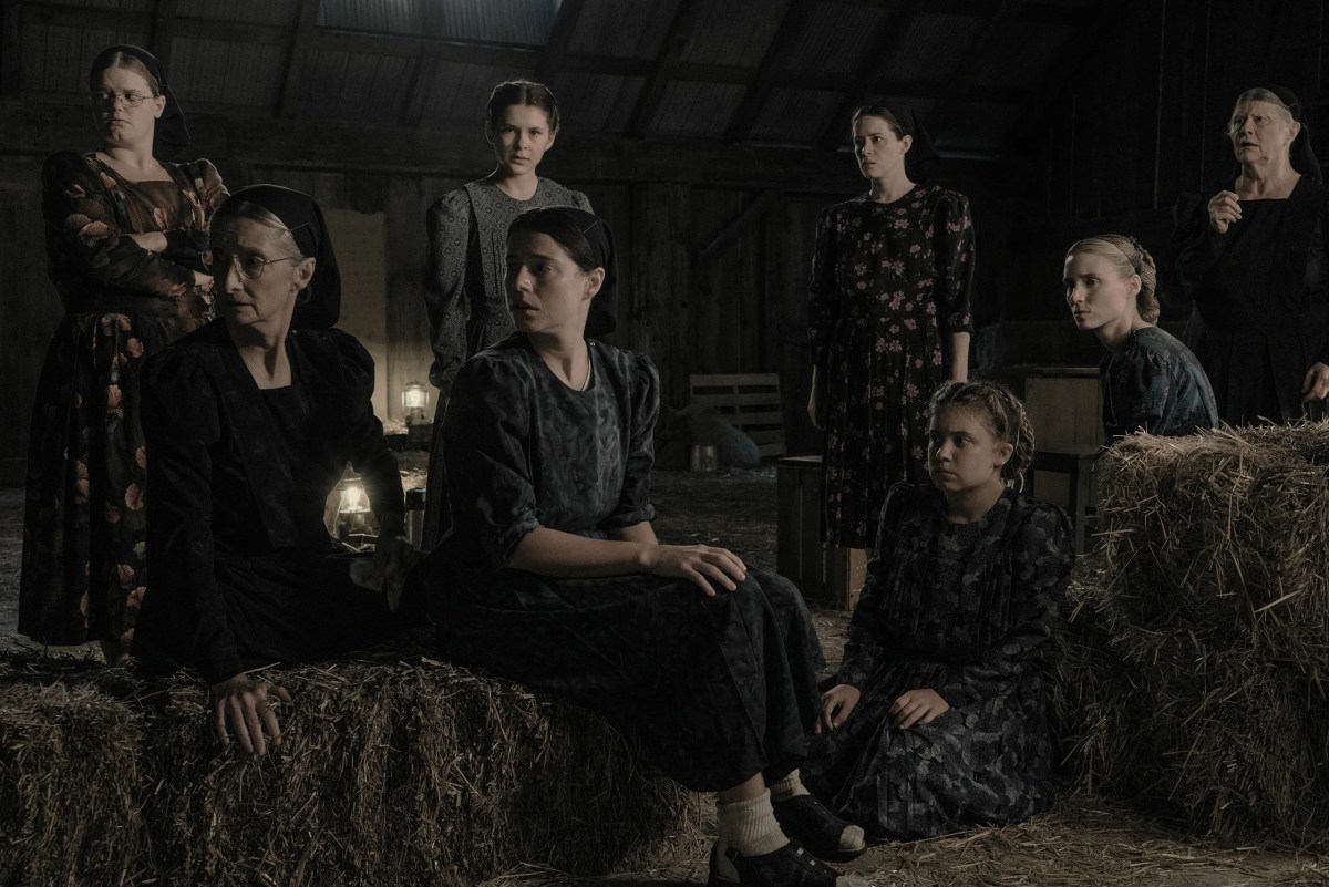 the women of 'women talking' sitting in a barn talking