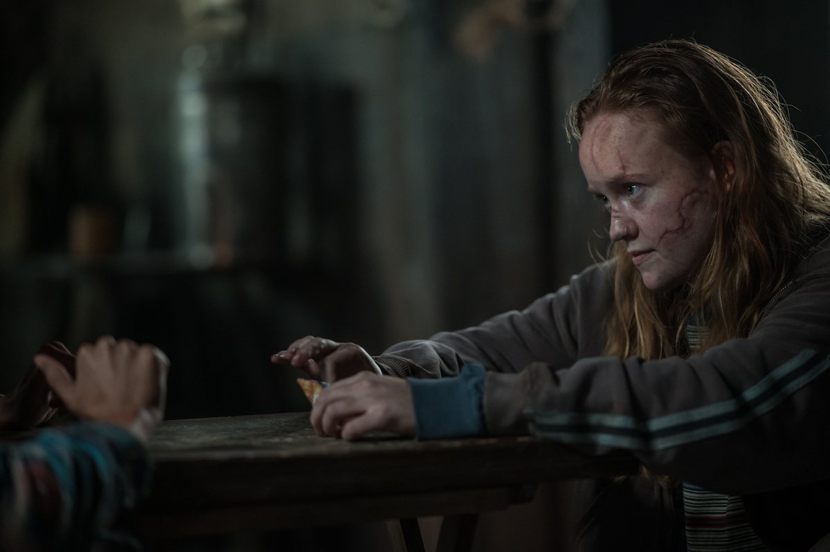 Yellowjackets Liv Hewson as Teen Van in YELLOWJACKETS Season 2 reaches hands out. Photo Credit: Kailey Schwerman/SHOWTIME.