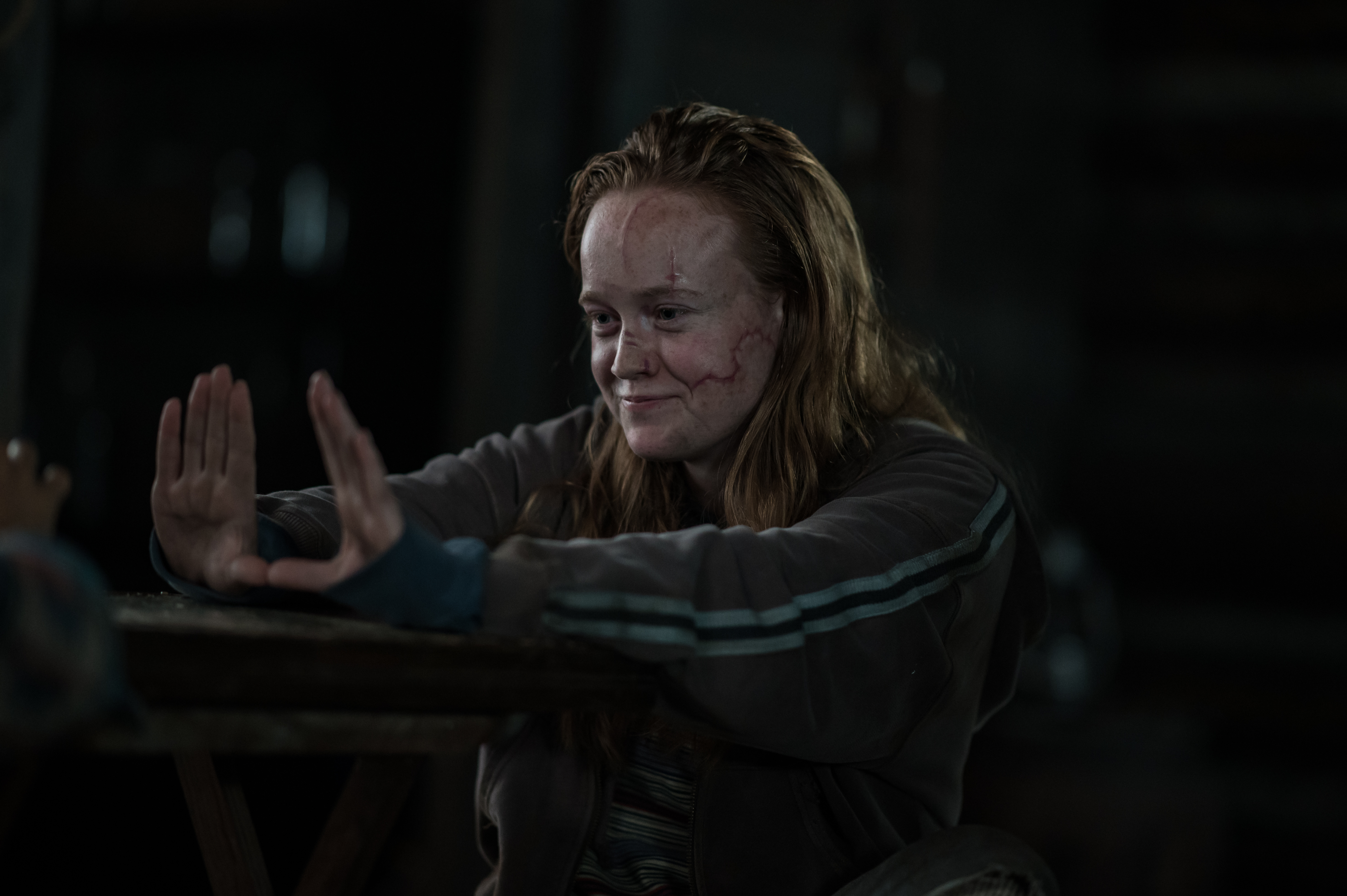 Yellowjackets Liv Hewson as Teen Van in YELLOWJACKETS Season 2 holds their hands out in front of them. Photo Credit: Kailey Schwerman/SHOWTIME.