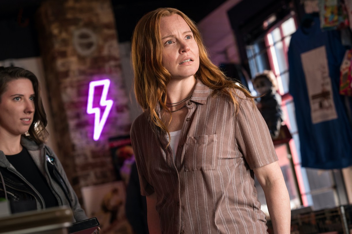 Lauren Ambrose as Van in YELLOWJACKETS Season 2 stands looking serious. Photo Credit: Kailey Schwerman/SHOWTIME.