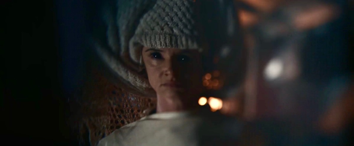 Adult Nat in a wool hat and with her pupils completely dilated.