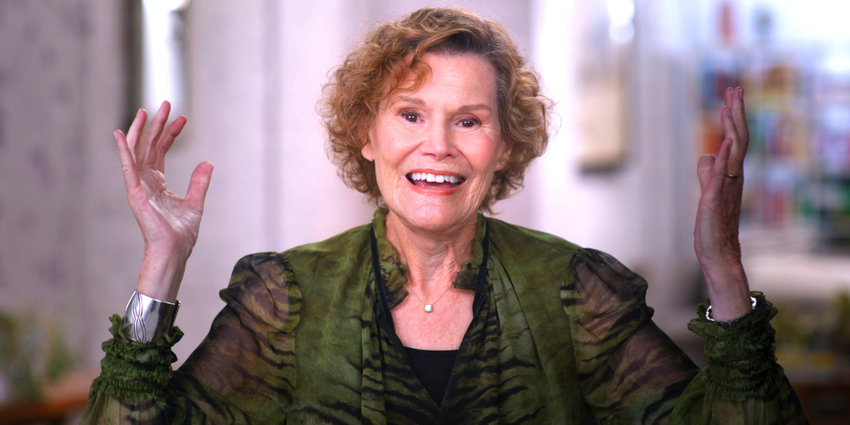 Judy Blume throwing her hands up