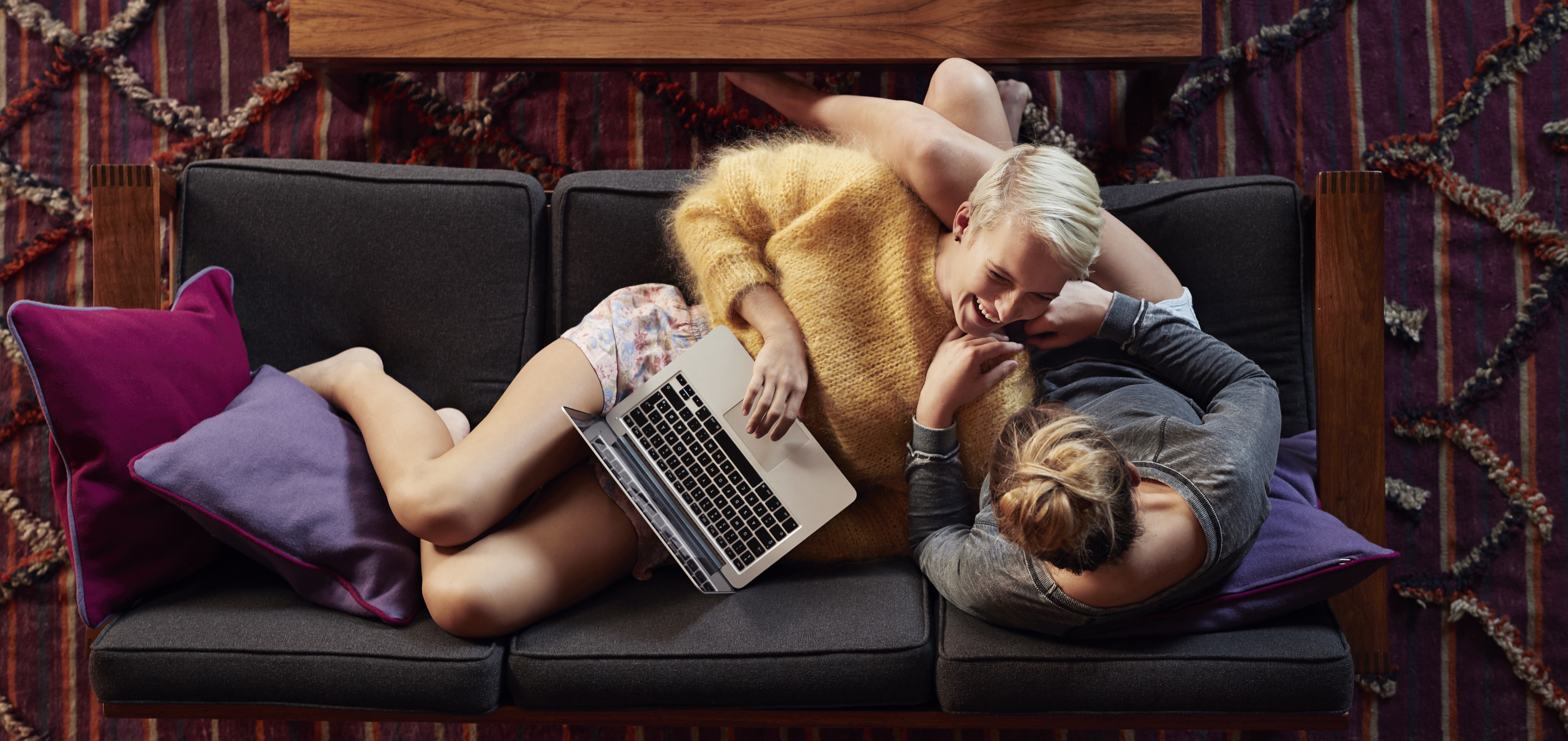 Two girlfriends hanging out in urban apartment