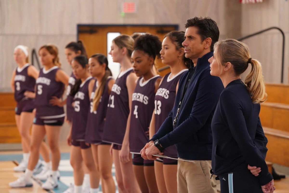 girls basketball team standing in a row