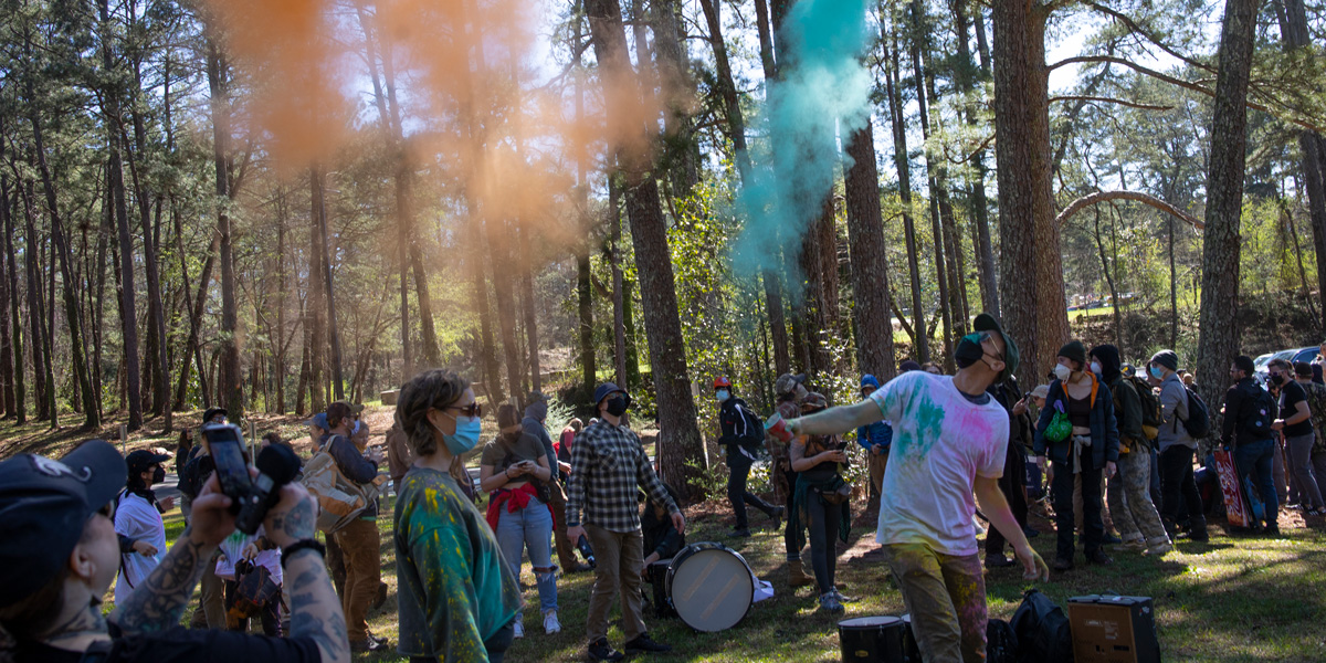 Environmental activists hold a rally and a march through the Atlanta Forest, a preserved forest Atlanta that is scheduled to be developed as a police training center, March 4, 2023 in Atlanta, Georgia. Intent upon stopping the building of what they have called cop city, the environmentalists were evicted from the forest in January, resulting in the killing by police of Manuel Teran, a young activist and medic.