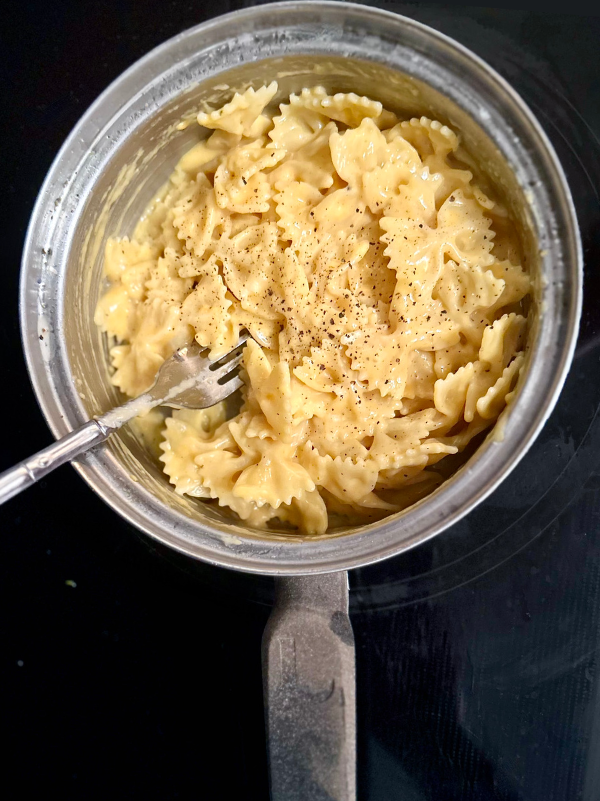 A close up of a photo of easy stovetop macaroni and cheese, made in 20 minutes, with bowtie pasta