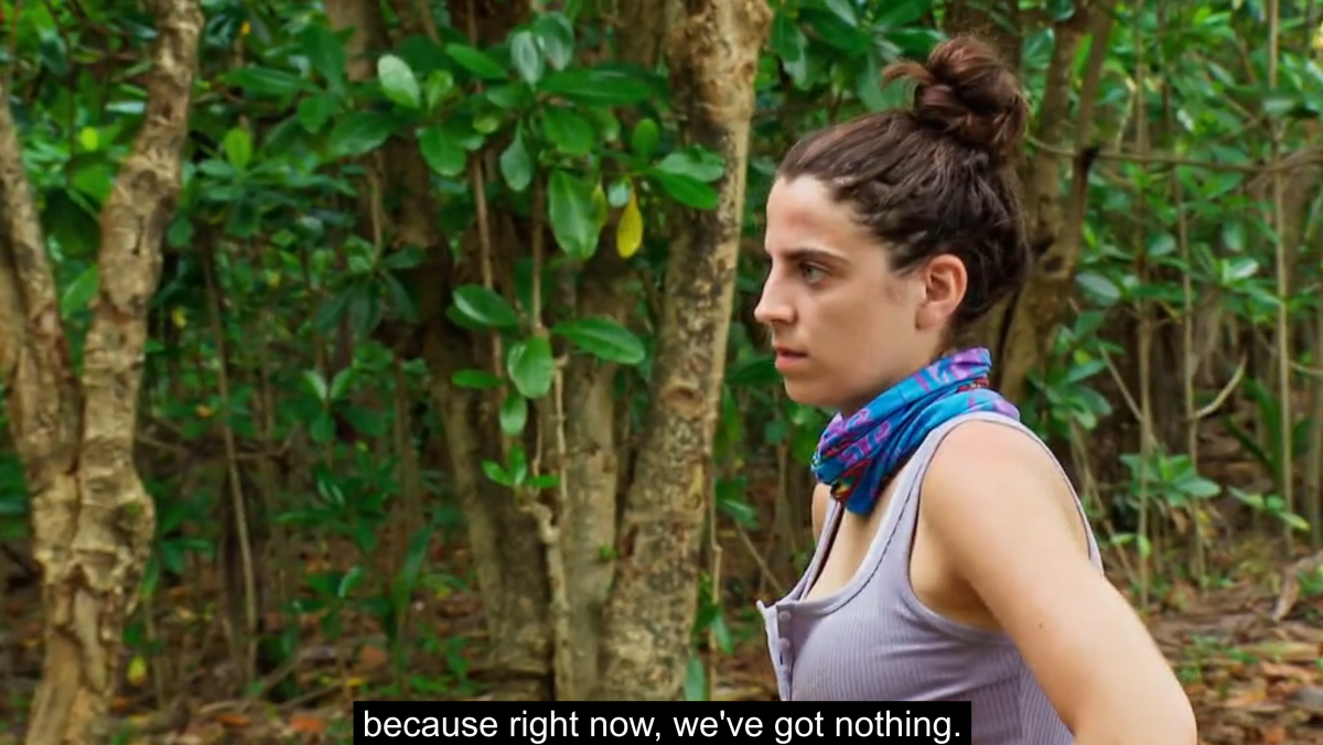 Profile view of Survivor Season 45 competitor Kellie Nalbandian accessing her surroundings