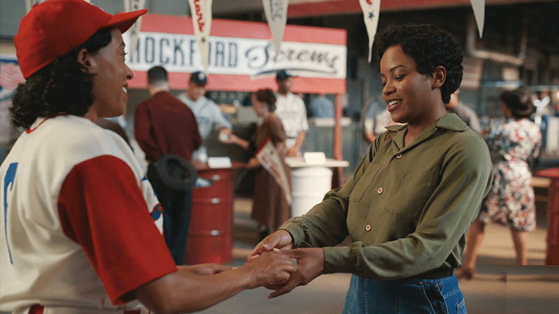 Max and Esther hold hands in A League of Their Own