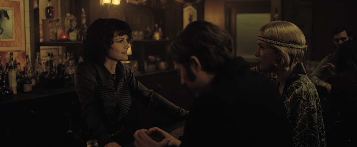 Carla Gugino behind a bar in The Fall of the House of Usher