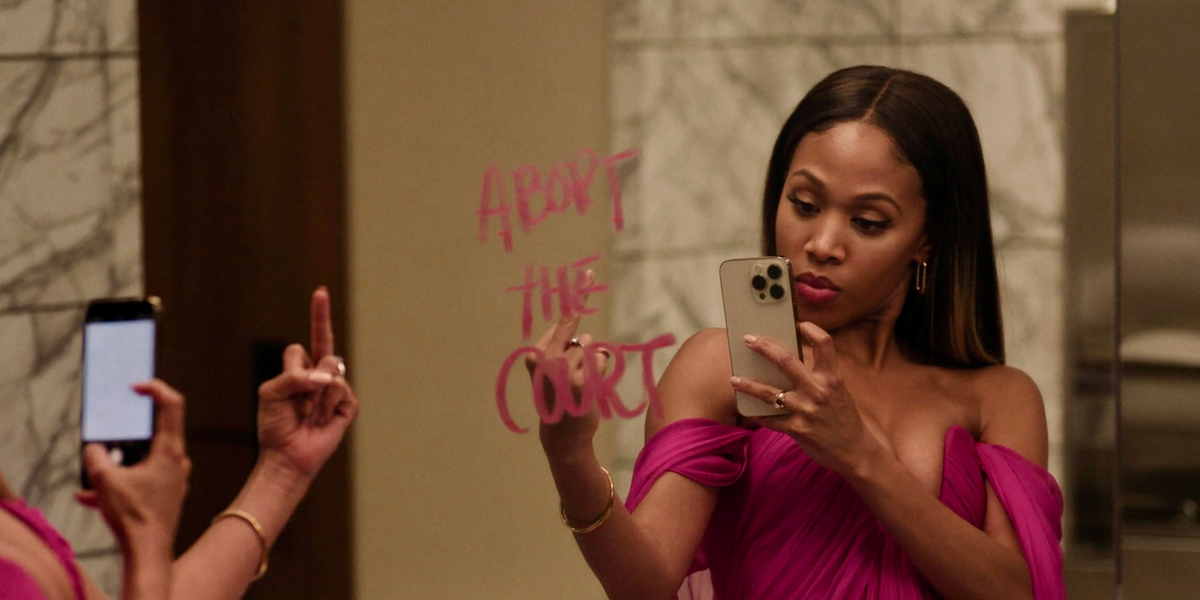 In the Morning Show episode 307, Chris gives a middle finger in the mirror while taking a selfie in front of a message that reads