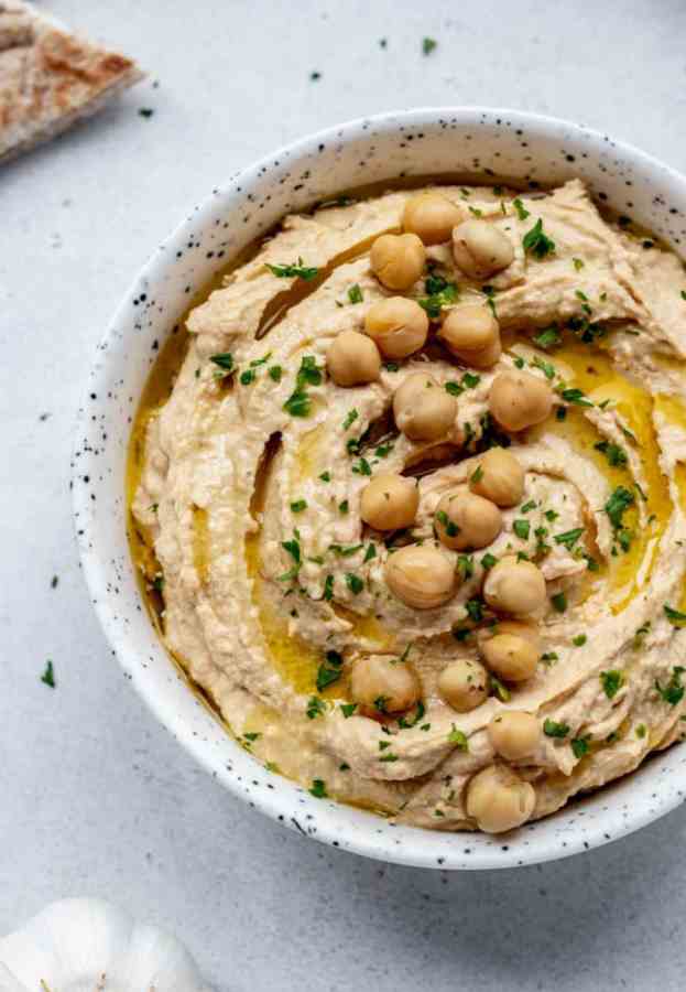 a bowl of spicy garlic hummus