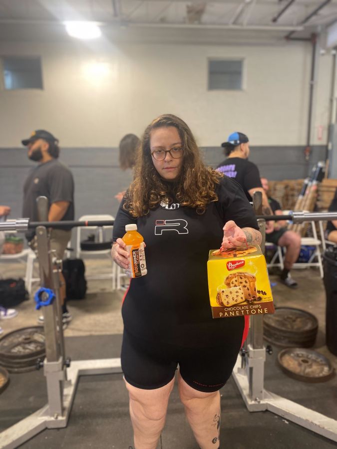 the author Stef Rubino holding a sports drink and a panettone