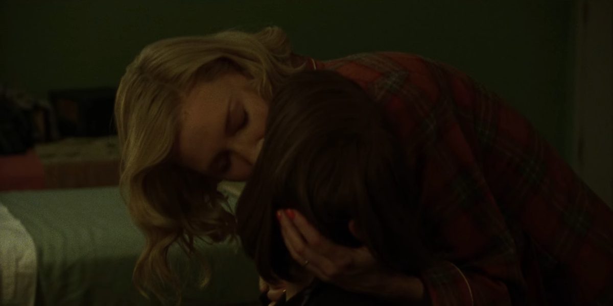 Carol bends down to kiss Therese