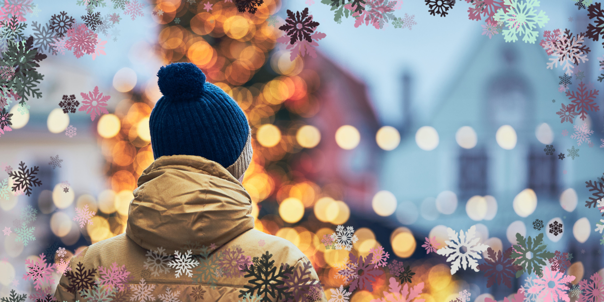 a person looking at a christmas tree, with an artsy lighting effect