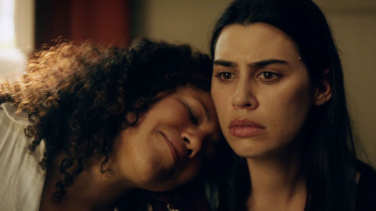 one woman looks despondent and the other is happy