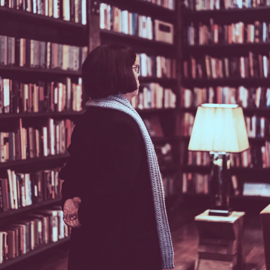 A person with a bob haircut in a library