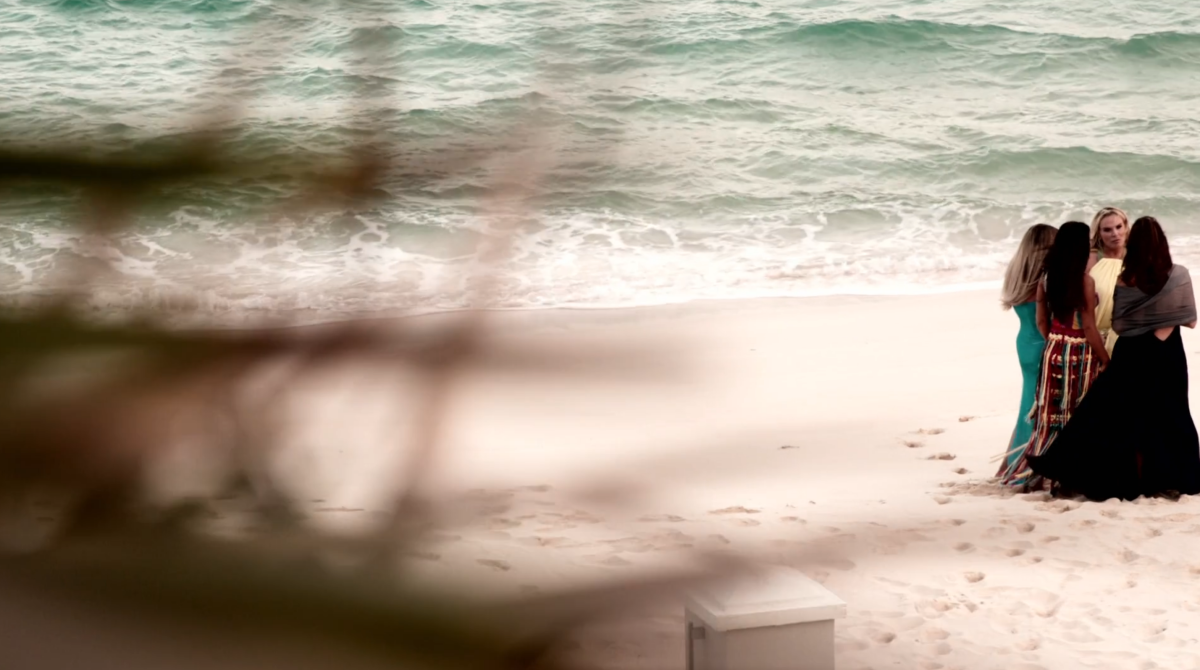 a far away shot of the cast of Salt Lake City on the beach